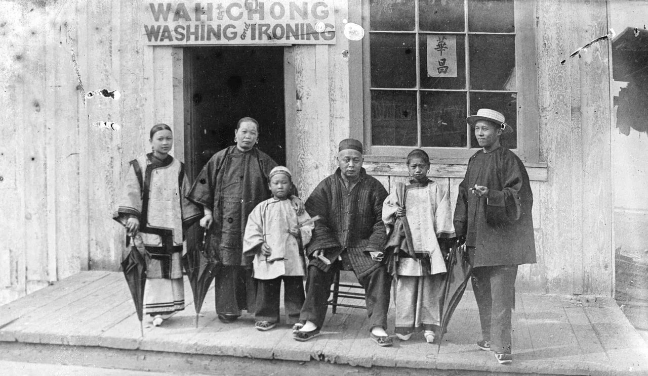 Wah Chong family outside their laundry business on Water Street, 1884. Source: City of Vancouver Archives SGN 435.1