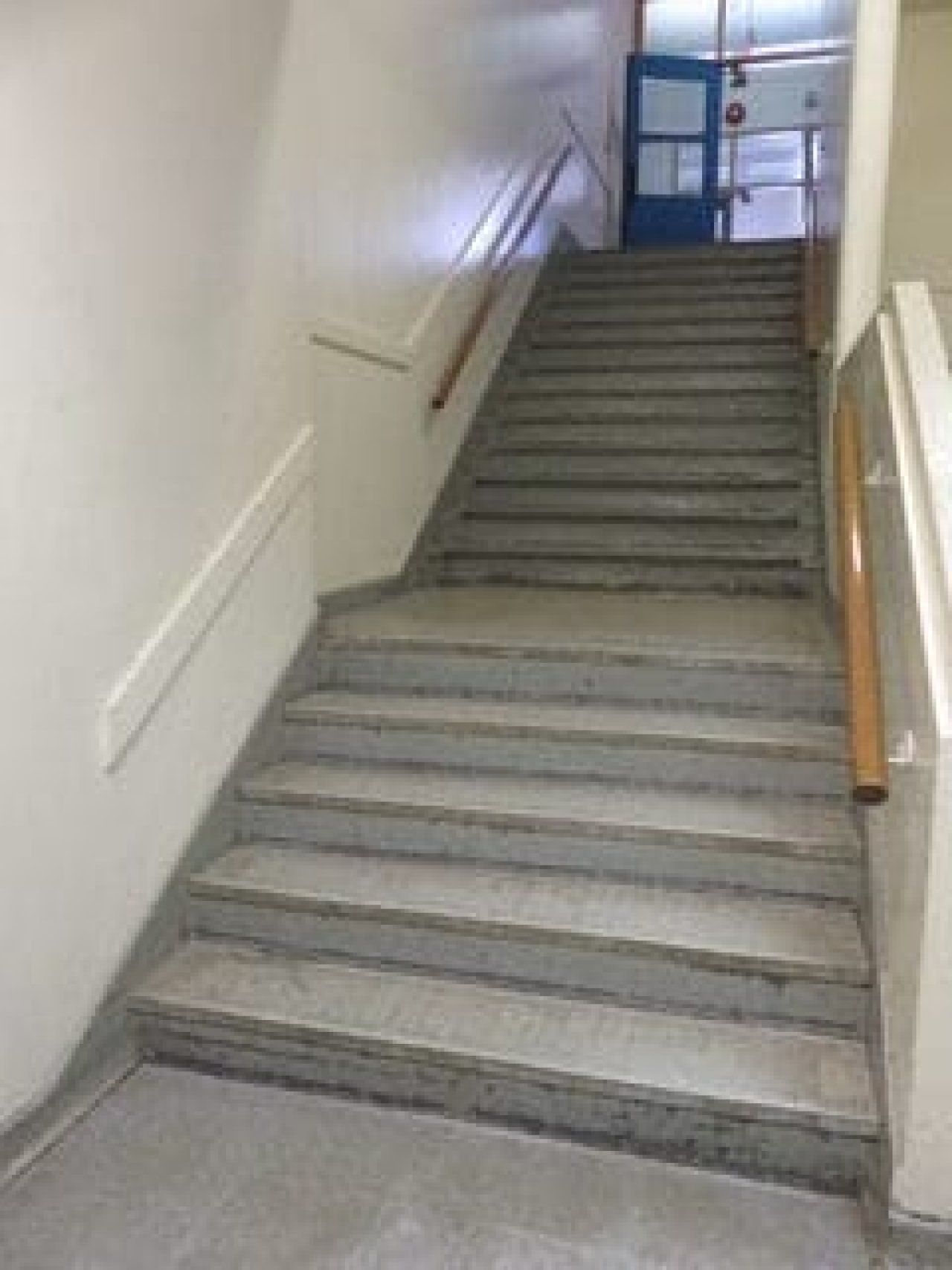 This is the stairwell on the left of the West side of the school. It was special because kids who were hungry knew they could leave the class and go to the lunchroom and make a sandwich on their own. They had been taught by Mary Jenkins, the school secretary. This was in the early 80’s. Credit: Kent Grier (2019)