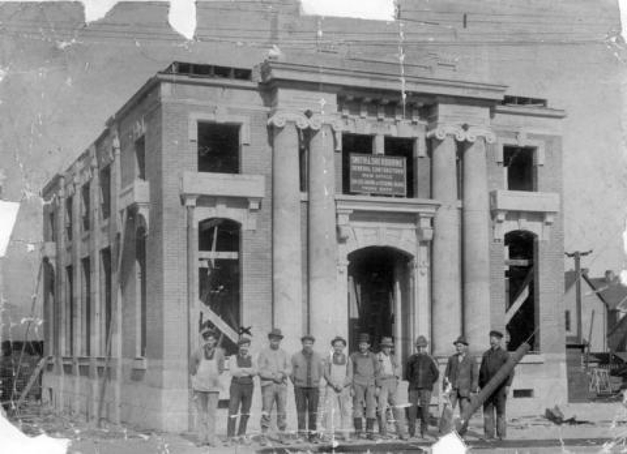 A group of men in front of the Canadian Imperial Bank of Commerce building under construction 2199 W 4th Avenue at Yew Street. c. 1912. Source: City of Vancouver Archives CVA 371-234