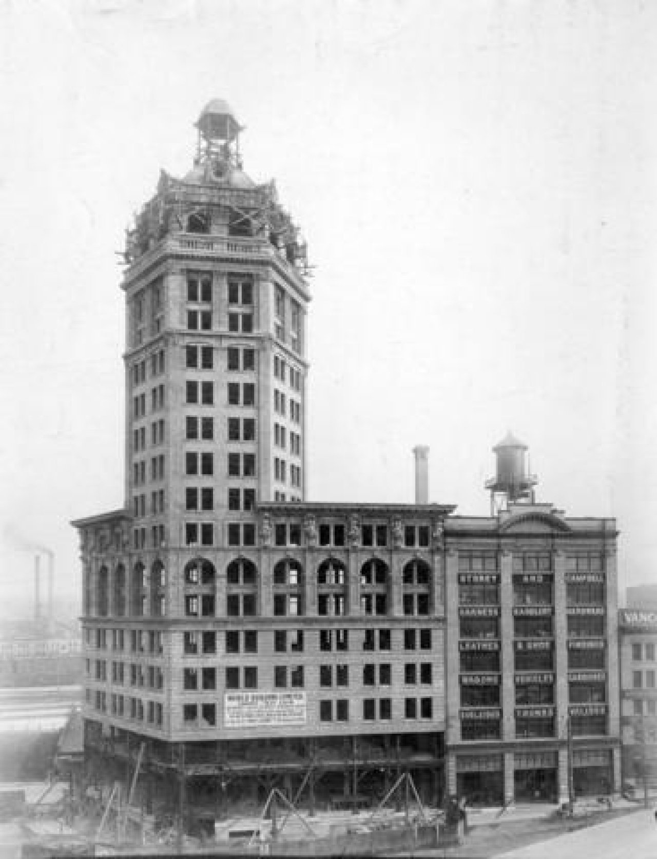 The World Building, later known as the Sun Tower and the Bekins Building, under construction in 1912. A sign on the building advertises World Building Limited shares for sale at $50.00 per share. Source: City of Vancouver Archives 1477-5